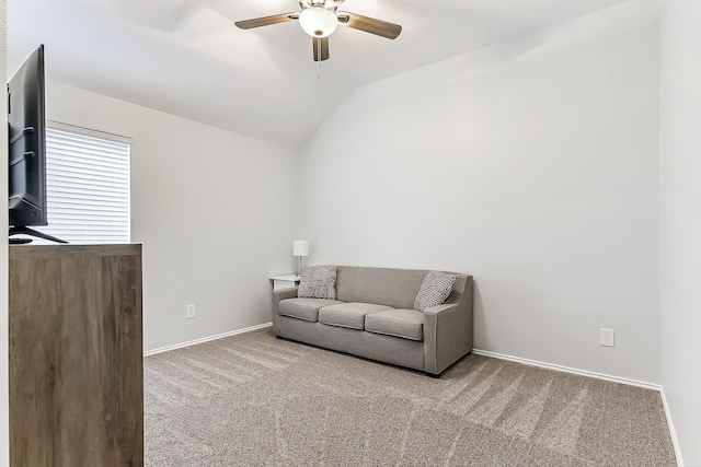 sitting room featuring baseboards, a ceiling fan, carpet, and lofted ceiling