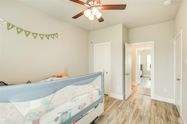 7709 Rainbow Close Ln, Houston, TX 77055 - bedroom featuring baseboards, ceiling fan, and light wood-style flooring