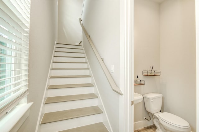 7709 Rainbow Close Ln, Houston, TX 77055 - stairway featuring wood finished floors