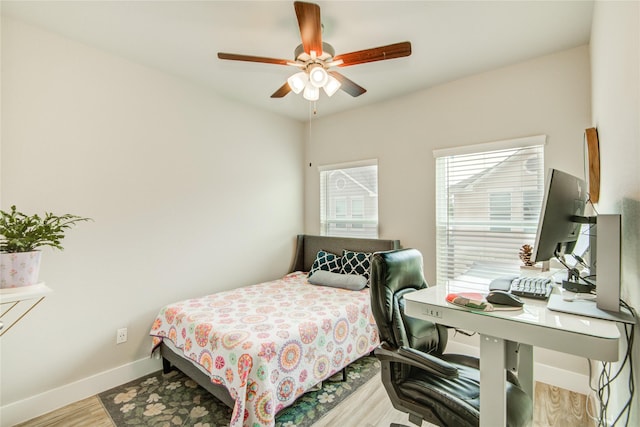 7709 Rainbow Close Ln, Houston, TX 77055 - bedroom featuring baseboards, ceiling fan, and wood finished floors