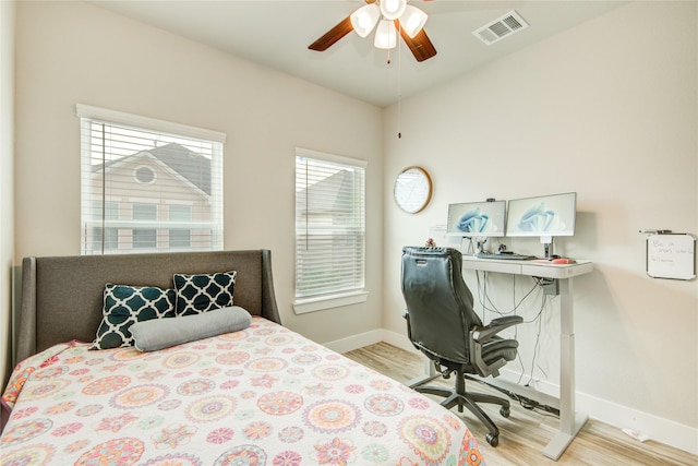 7709 Rainbow Close Ln, Houston, TX 77055 - bedroom with visible vents, baseboards, ceiling fan, and wood finished floors