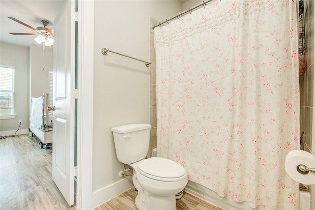 7709 Rainbow Close Ln, Houston, TX 77055 - bathroom featuring a shower with curtain, baseboards, a ceiling fan, and wood finished floors