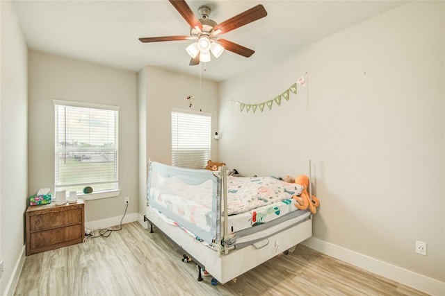 7709 Rainbow Close Ln, Houston, TX 77055 - bedroom with a ceiling fan, baseboards, and wood finished floors