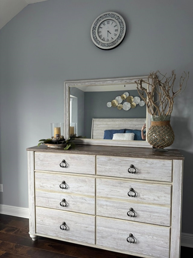 room details with baseboards and wood finished floors