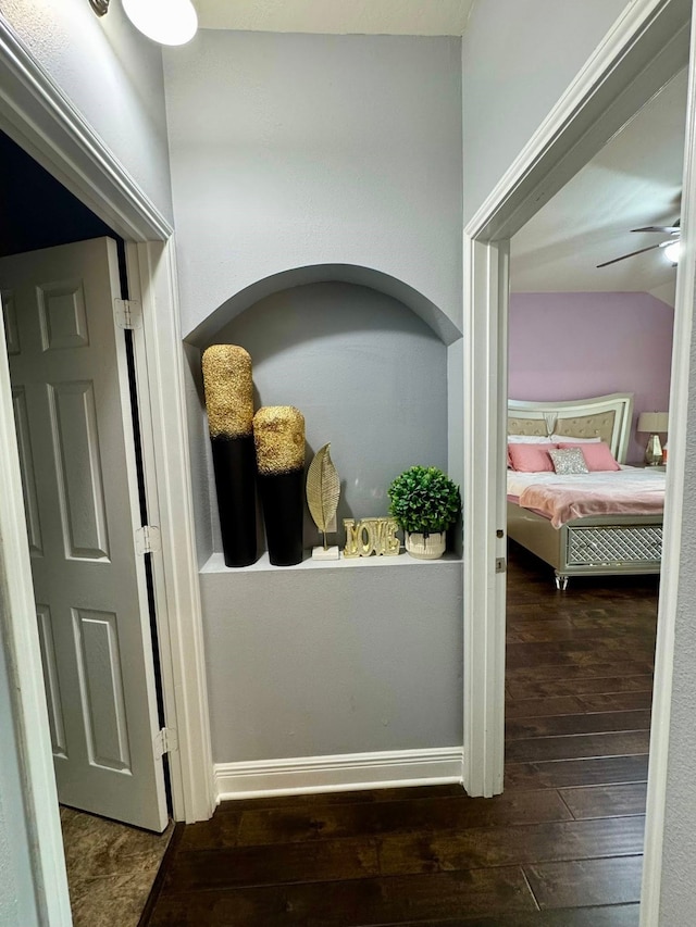 hall with hardwood / wood-style flooring