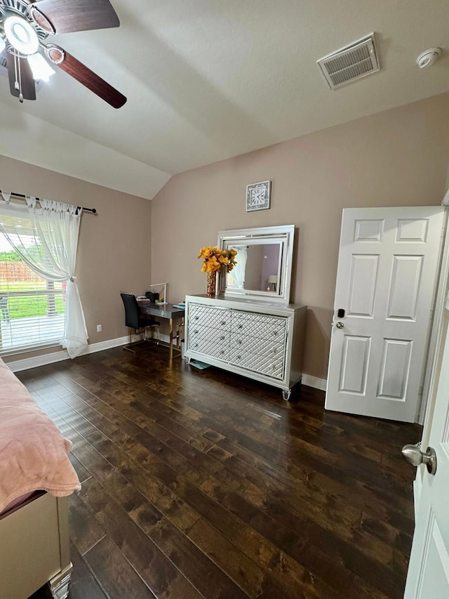 bedroom featuring ceiling fan, baseboards, lofted ceiling, dark wood-type flooring, and visible vents