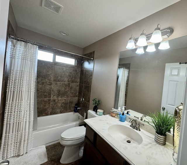 bathroom featuring visible vents, shower / bath combo, toilet, and vanity