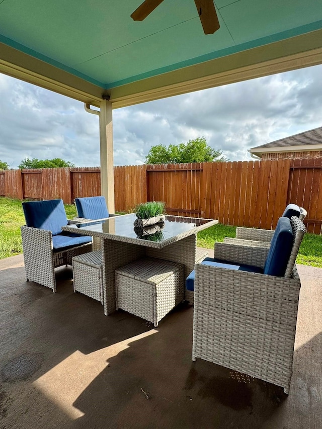 view of patio featuring a fenced backyard, a ceiling fan, outdoor dining area, and outdoor lounge area