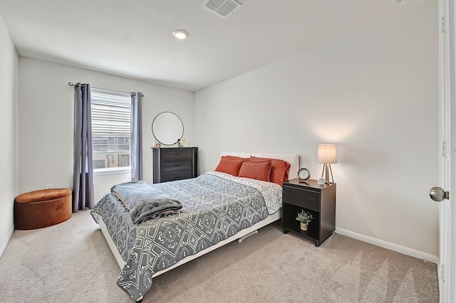 bedroom featuring carpet floors, baseboards, and visible vents