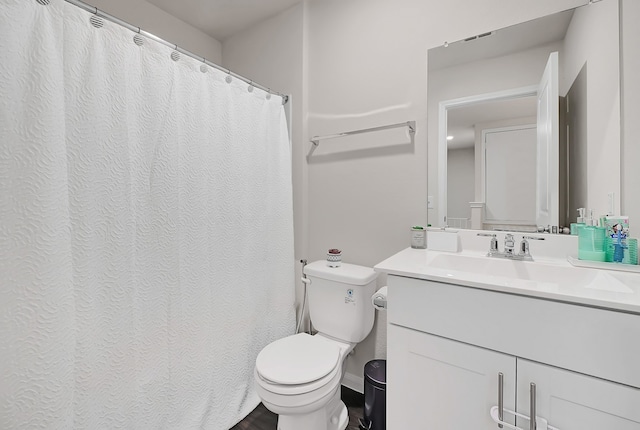 full bathroom with vanity and toilet