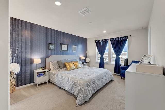 bedroom featuring an accent wall, carpet, recessed lighting, baseboards, and visible vents