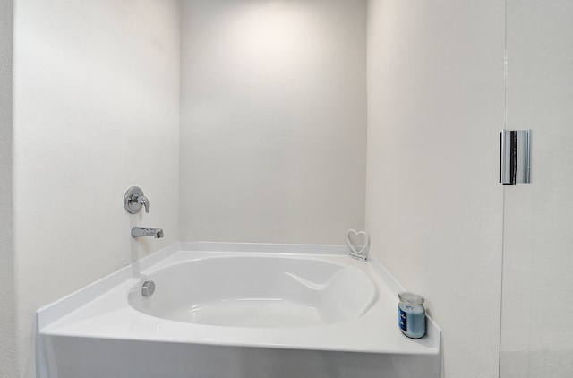 bathroom featuring a bath