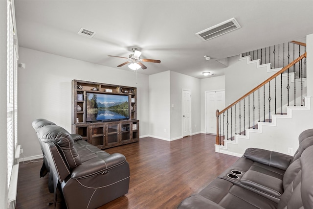living area with dark wood-style flooring, stairs, a ceiling fan, baseboards, and visible vents