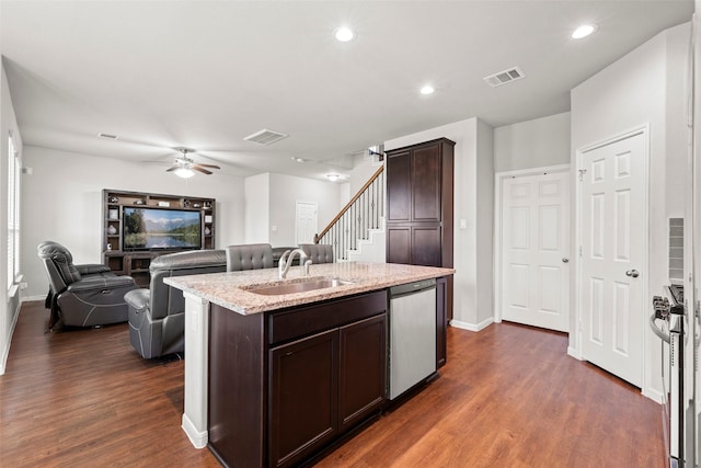 kitchen with visible vents, dark brown cabinetry, a sink, dark wood finished floors, and appliances with stainless steel finishes