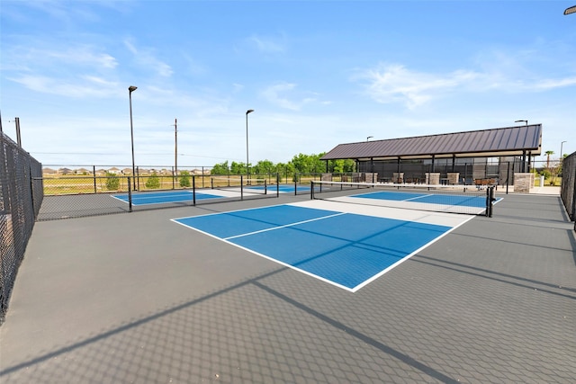 view of sport court with fence