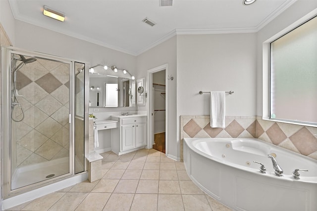 full bathroom featuring a tub with jets, tile patterned floors, a stall shower, and vanity