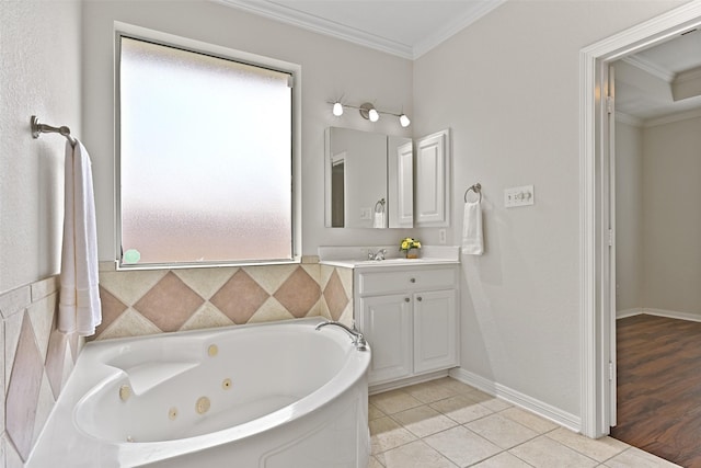 bathroom with crown molding, tile patterned floors, vanity, and a jetted tub