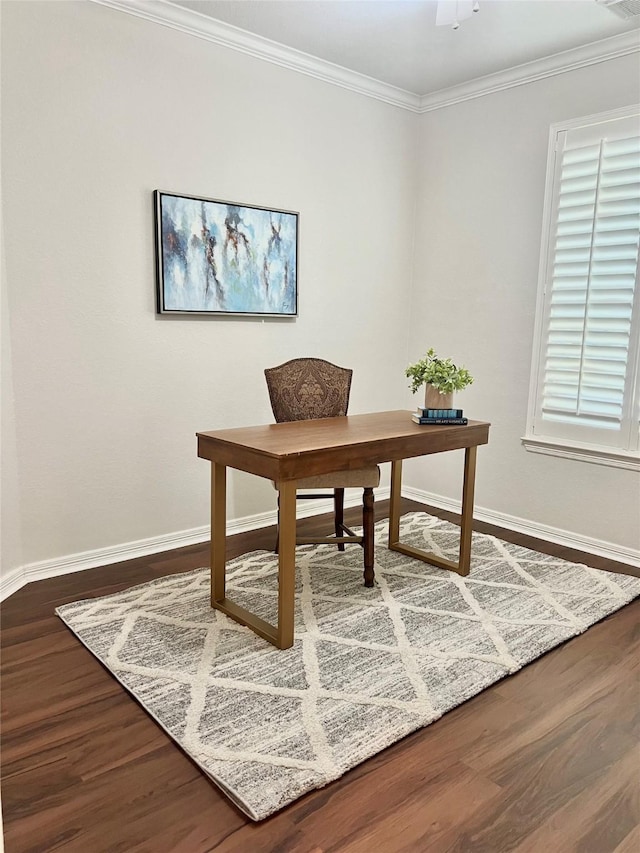 office space featuring crown molding, dark wood-style flooring, and baseboards