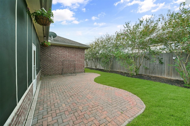 view of patio / terrace featuring fence
