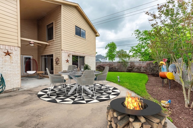 6627 Gleneagles Dr, Pasadena, TX 77505 - view of patio / terrace featuring ceiling fan, fence, a fire pit, and outdoor dining area