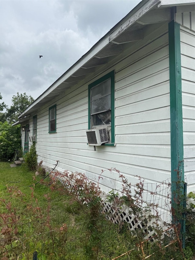 view of side of property featuring cooling unit