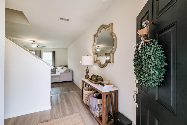 24169 Wilde Dr, Magnolia, TX 77355 - corridor featuring baseboards, visible vents, stairway, and light wood-style floors