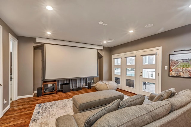 cinema room with baseboards, recessed lighting, and wood finished floors