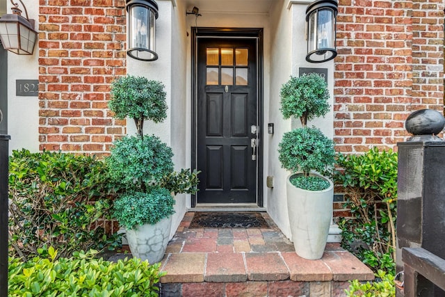 entrance to property with brick siding