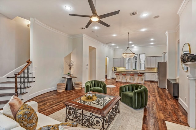 living room with crown molding, stairway, recessed lighting, a ceiling fan, and dark wood finished floors