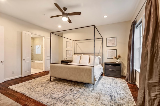 bedroom with a ceiling fan, baseboards, ensuite bathroom, recessed lighting, and dark wood-type flooring