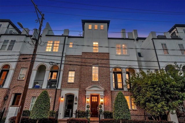 view of property featuring brick siding