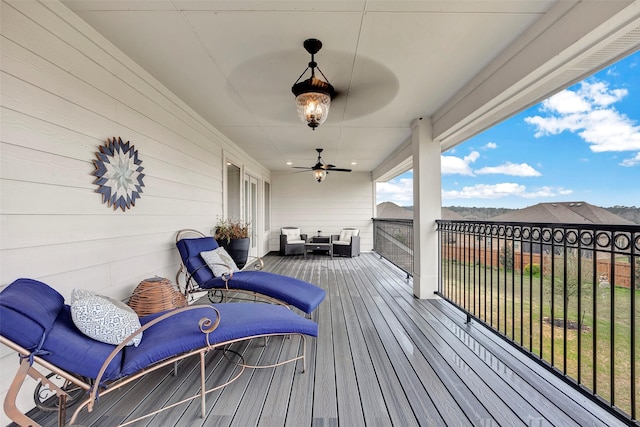 6006 Henry Hamlet Dr, Conroe, TX 77304 - deck with ceiling fan and an outdoor hangout area