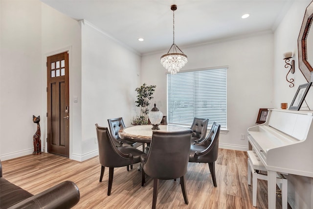 6006 Henry Hamlet Dr, Conroe, TX 77304 - dining space featuring light wood finished floors, a chandelier, baseboards, ornamental molding, and recessed lighting