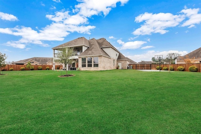 6006 Henry Hamlet Dr, Conroe, TX 77304 - rear view of house featuring a balcony, brick siding, and a patio