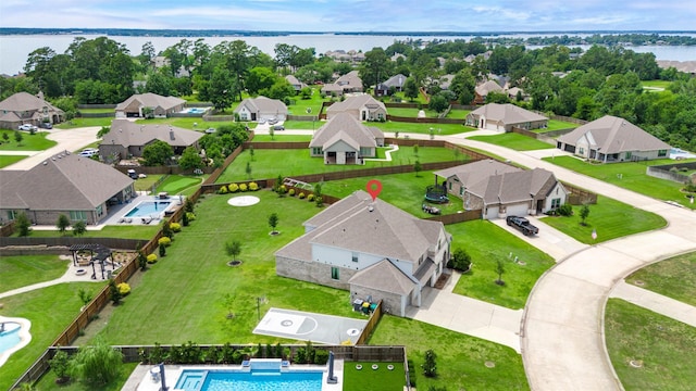 6006 Henry Hamlet Dr, Conroe, TX 77304 - aerial view of residential area with a large body of water and a pool