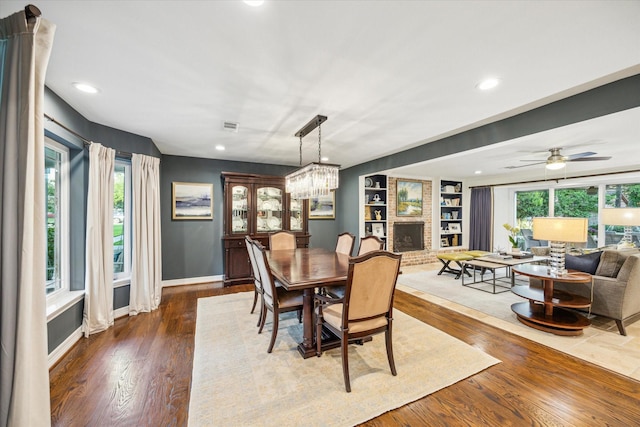 dining area featuring visible vents, built in features, baseboards, dark wood-style floors, and recessed lighting