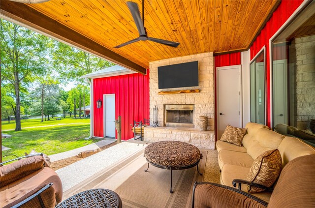 15062 Lake Paula Dr, Willis, TX 77318 - view of patio / terrace with ceiling fan and an outdoor living space with a fireplace