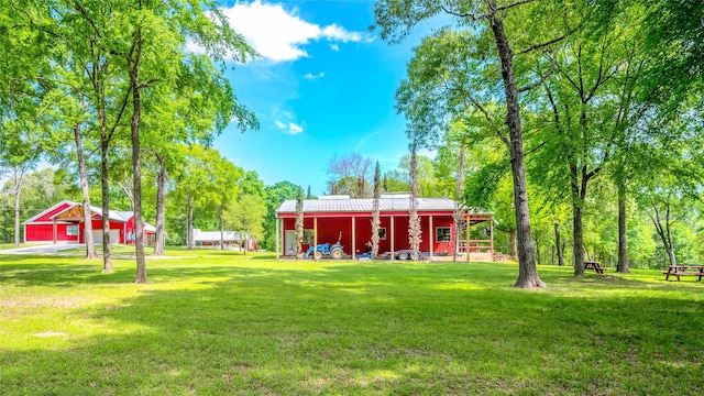 15062 Lake Paula Dr, Willis, TX 77318 - view of yard featuring an outdoor structure and an outbuilding