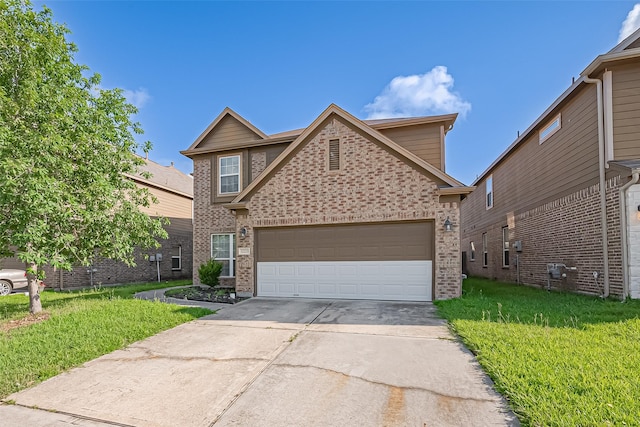 traditional home with an attached garage, a front yard, driveway, and brick siding