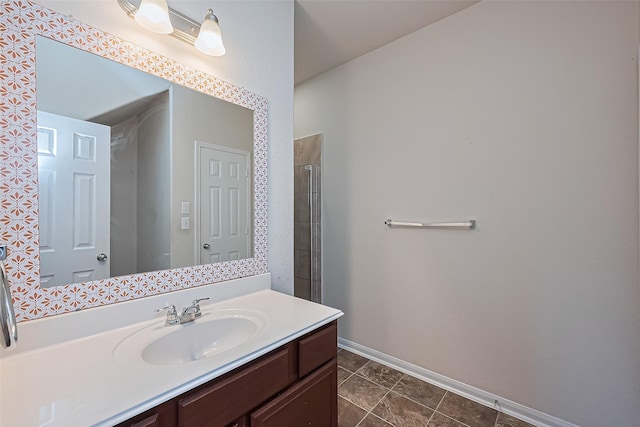 bathroom featuring baseboards, vanity, and tile patterned floors