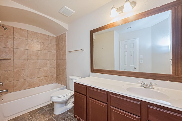 bathroom featuring toilet,  shower combination, visible vents, and vanity