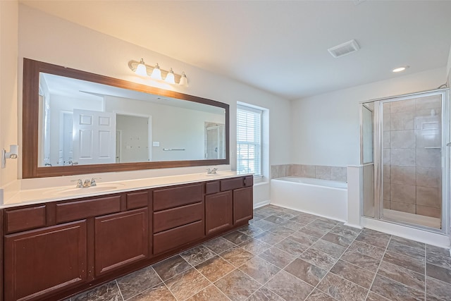 bathroom with a sink and a stall shower