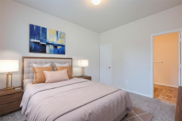 carpeted bedroom with baseboards