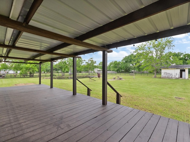 14800 Tallow St, Santa Fe, TX 77517 - wooden terrace with a lawn, a fenced backyard, a shed, and an outbuilding