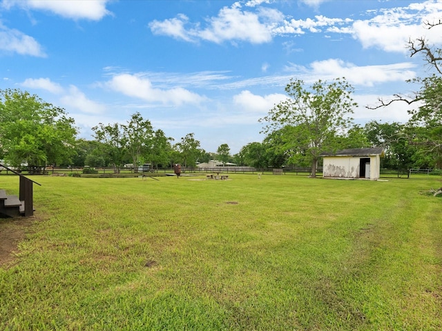 14800 Tallow St, Santa Fe, TX 77517 - view of yard featuring a storage shed, fence, and an outdoor structure