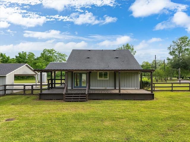 14800 Tallow St, Santa Fe, TX 77517 - rear view of house featuring board and batten siding, roof with shingles, a deck, fence, and a yard