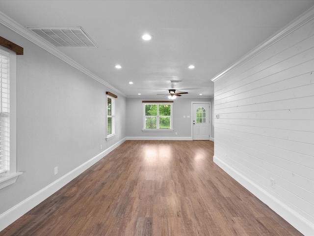 14800 Tallow St, Santa Fe, TX 77517 - unfurnished living room with visible vents, wood finished floors, baseboards, ornamental molding, and recessed lighting