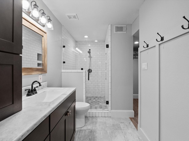 14800 Tallow St, Santa Fe, TX 77517 - bathroom with vanity, a shower stall, toilet, and visible vents