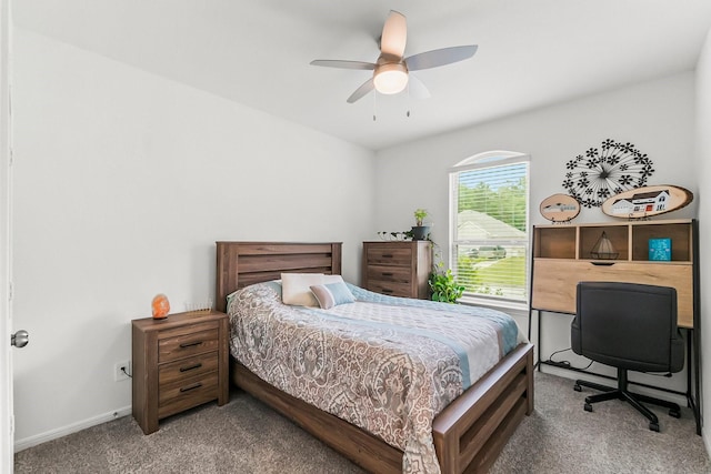 bedroom with baseboards, a ceiling fan, and carpet flooring