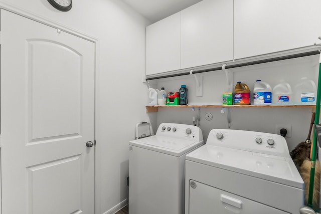 laundry area with cabinet space and washing machine and dryer